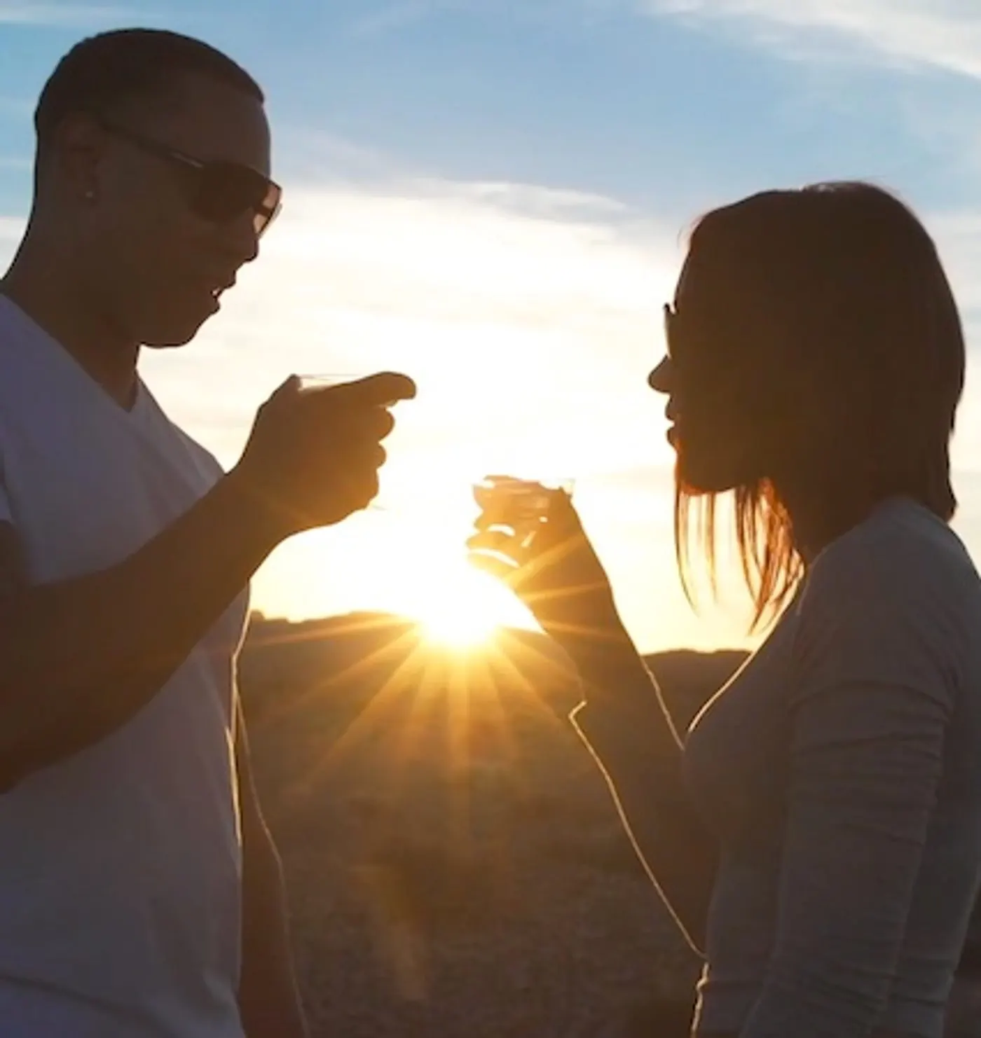 Couple toasting with champagne at sunset in Valley of Fire